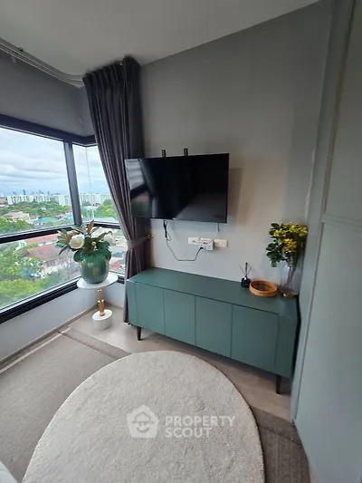 Stylish corner unit with modern decor and large windows offering a stunning city view.