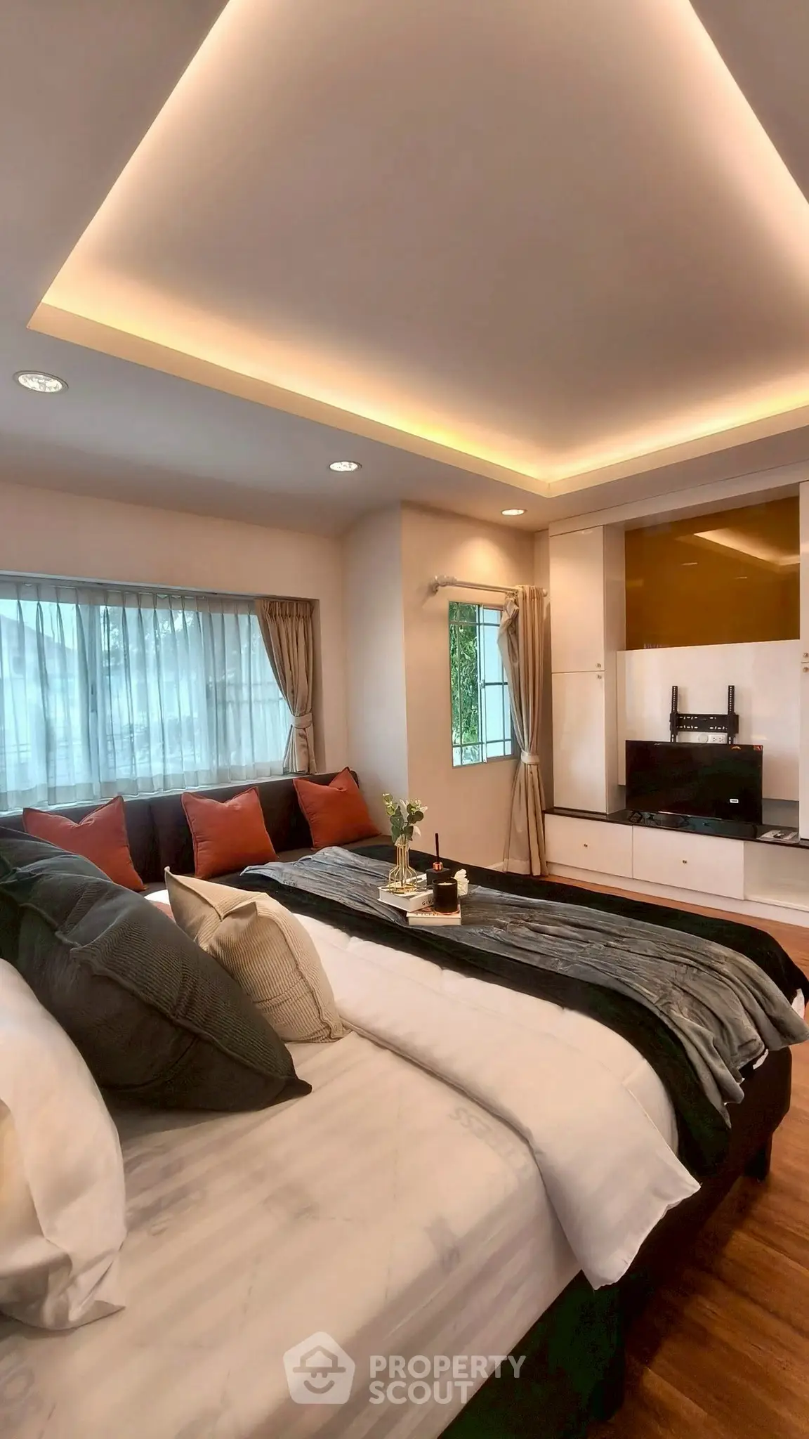 Luxurious bedroom with modern decor and ambient lighting