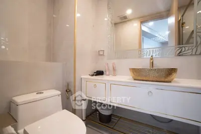 Luxurious bathroom with elegant gold accents and modern fixtures