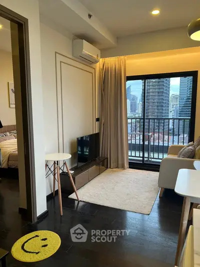 Modern living room with city view, stylish decor, and cozy ambiance in urban apartment.