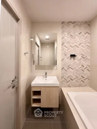 Modern bathroom with stylish tile design and sleek fixtures