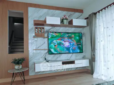 Modern living room with stylish TV setup and elegant decor