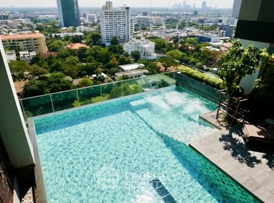 Luxurious rooftop pool with stunning cityscape views in a high-rise building.
