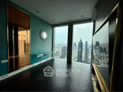 Luxurious high-rise living room with stunning cityscape view and modern decor.