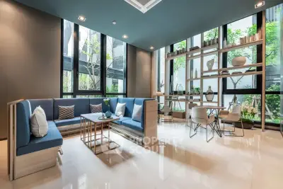 Modern living room with large windows and stylish furniture in a contemporary apartment.