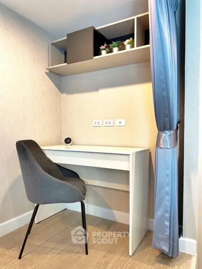 Cozy study nook with modern desk and chair, perfect for productivity.