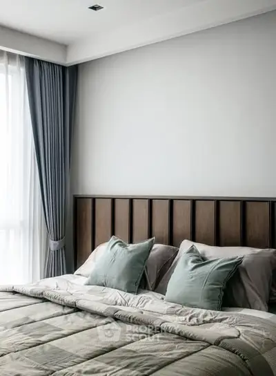 Elegant bedroom with modern decor and natural light