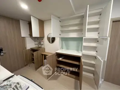 Modern kitchen with ample storage and sleek wooden cabinets