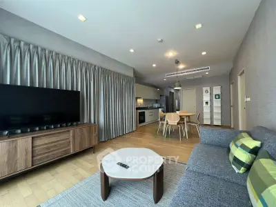 Spacious modern living room with open kitchen and stylish decor