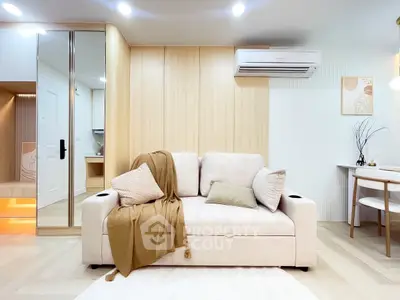 Modern living room with stylish beige sofa and elegant decor