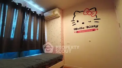 Charming bedroom with Hello Kitty decor and cozy ambiance