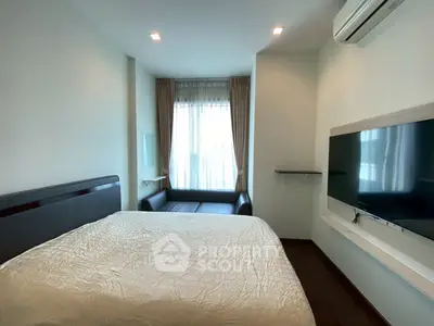 Cozy bedroom with modern furnishings and natural light