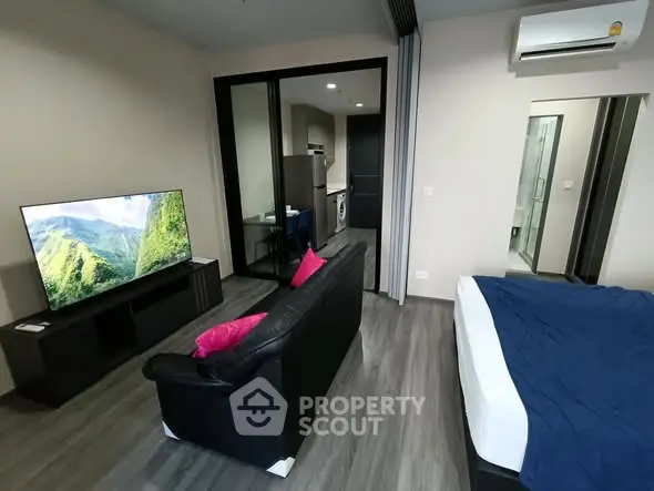 Modern studio apartment with open layout and sleek furnishings