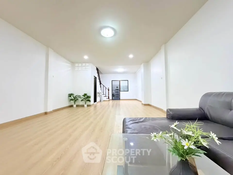 Spacious modern living room with sleek flooring and stylish furniture