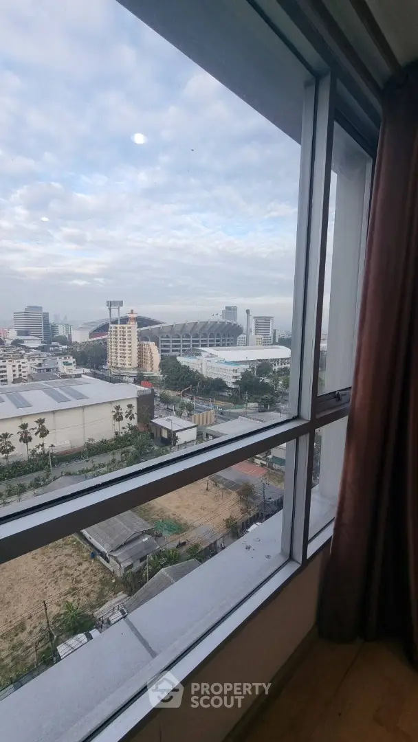 Stunning cityscape view from high-rise apartment window with expansive skyline