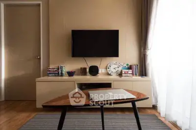 Modern living room with sleek TV setup and stylish coffee table