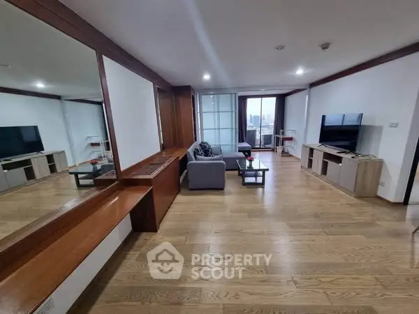 Spacious modern living room with wooden flooring and city view