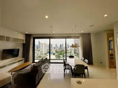 Spacious living room with stunning city view and modern furnishings