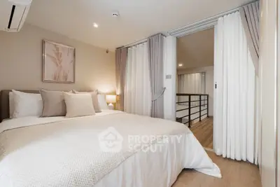Luxurious bedroom with elegant decor and soft lighting, featuring a cozy bed and stylish curtains.