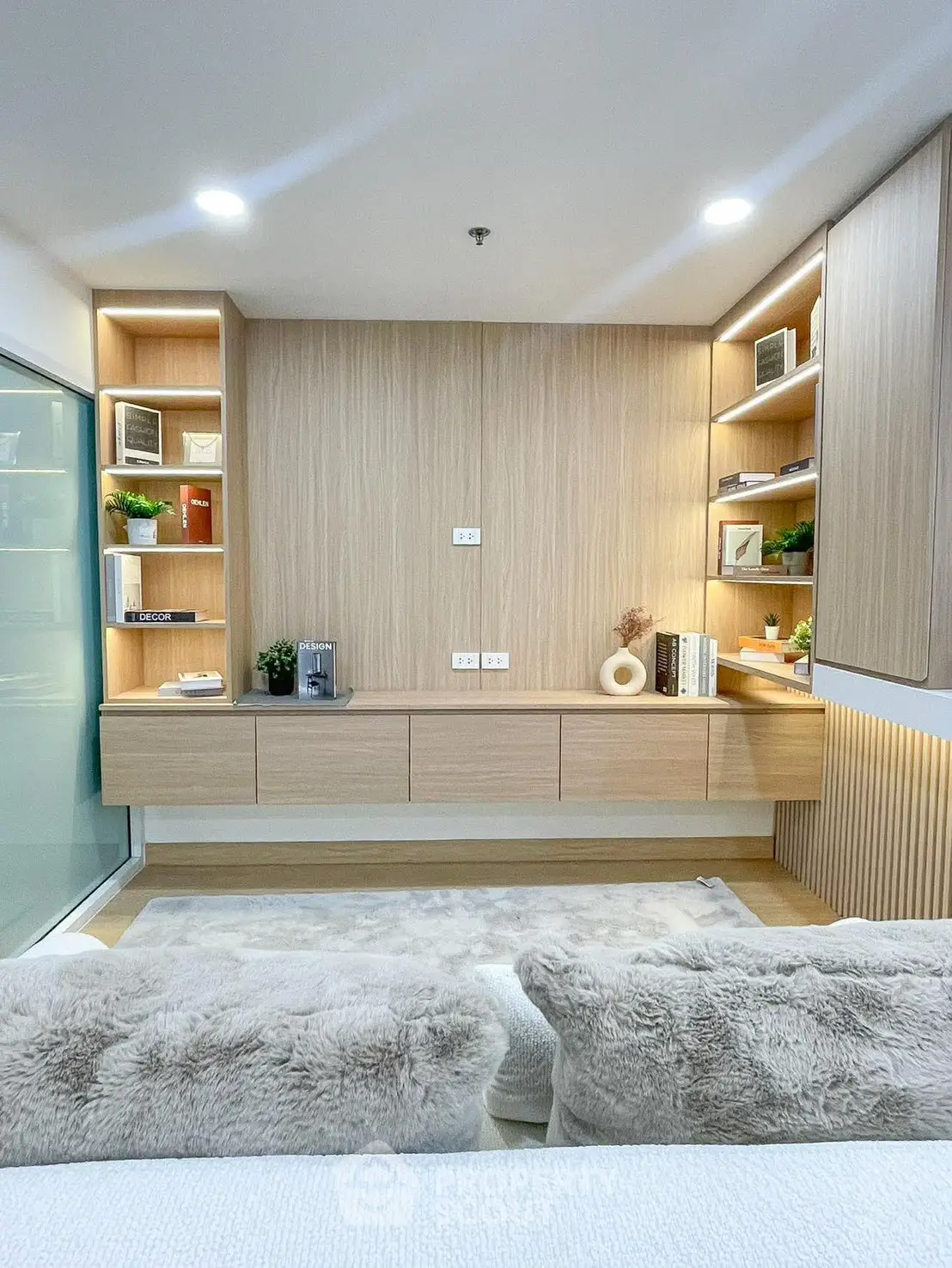 Modern living room with built-in shelves and cozy decor