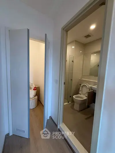 Modern apartment hallway with bathroom and storage area