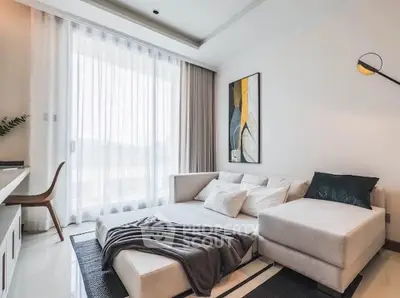 Modern living room with stylish decor and large window for natural light