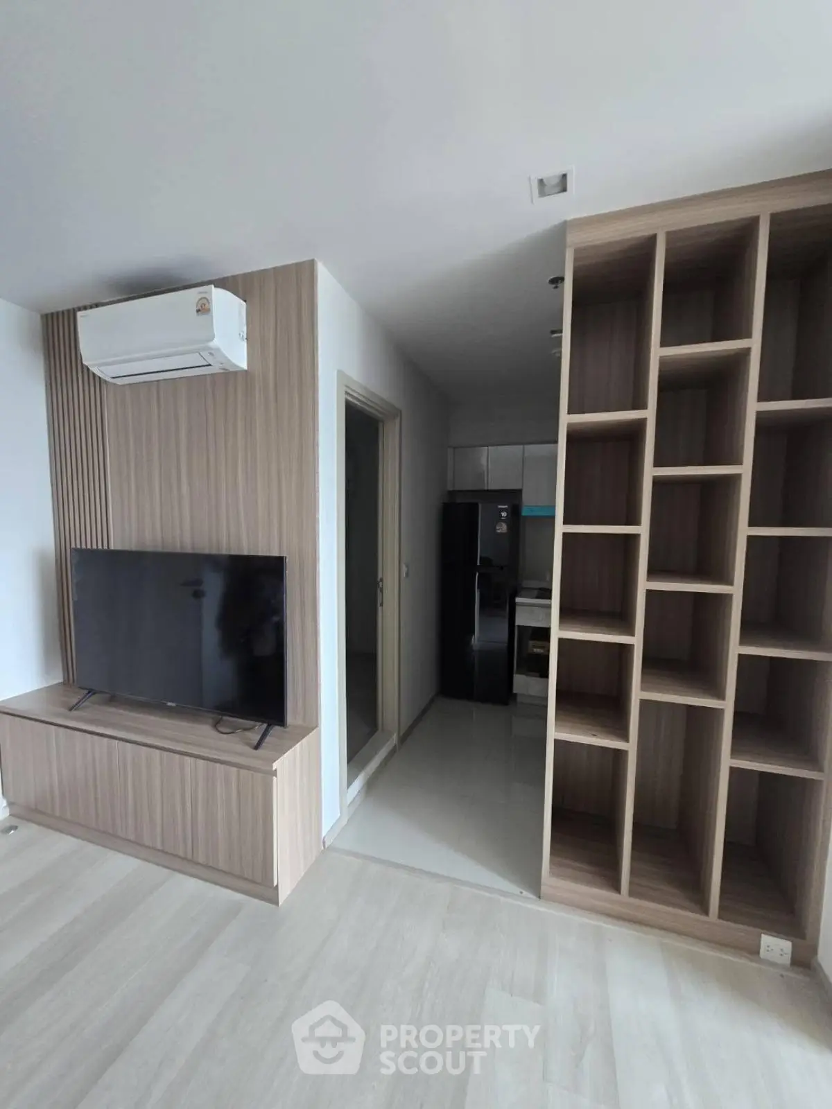 Modern living room with built-in shelves and sleek TV setup