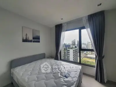 Modern bedroom with city view and large window, featuring stylish curtains and minimalistic decor.