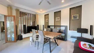 Spacious modern living room with elegant dining area and stylish decor