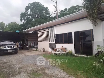 Charming single-story home with spacious outdoor area and ample parking space.