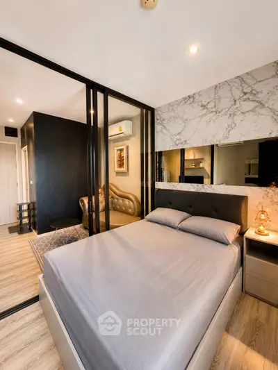 Modern bedroom with glass partition and stylish decor