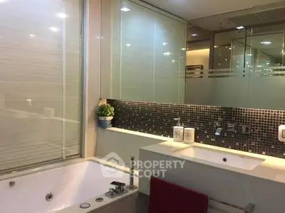 Luxurious bathroom with modern fixtures and elegant bathtub in a stylish home.