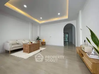 Spacious modern living room with elegant lighting and stylish furniture