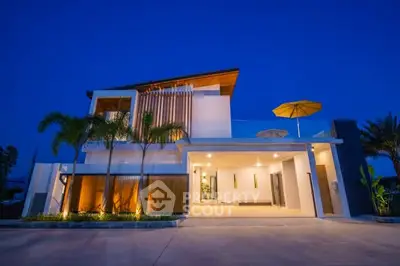 Stunning modern villa with elegant architecture and ambient lighting at dusk.