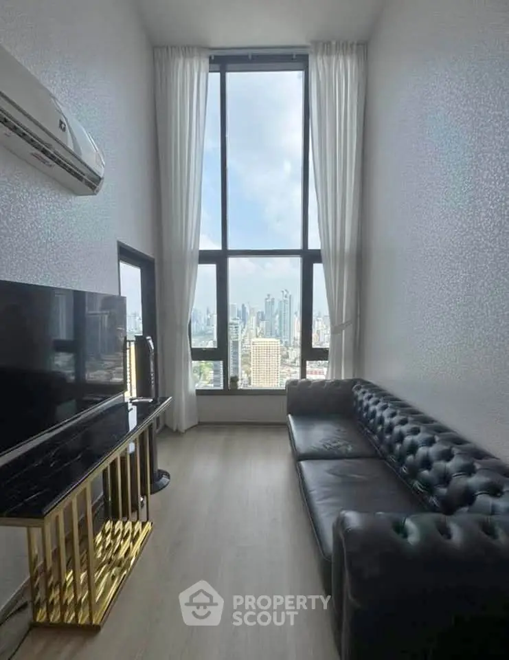 Luxurious living room with high ceilings and stunning city view, featuring elegant leather sofa and modern decor.