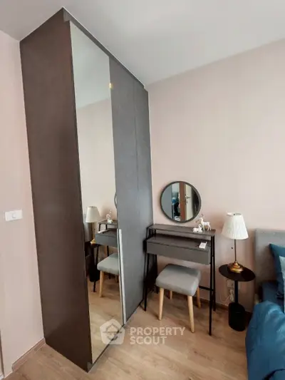 Modern bedroom with stylish wardrobe and cozy dressing table setup
