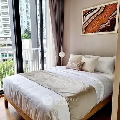 Modern bedroom with large windows and stylish decor in urban apartment