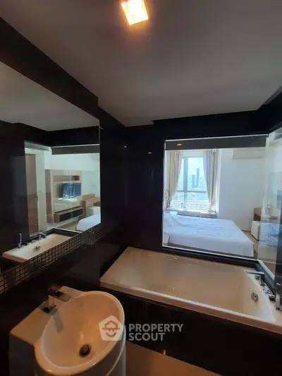 Luxurious bathroom with bathtub and city view in modern apartment