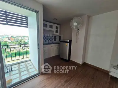 Charming apartment with balcony and compact kitchen, perfect for modern living.