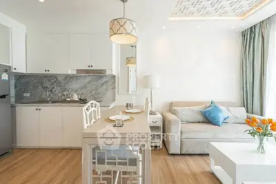 Modern open-layout living room with stylish kitchen and elegant decor