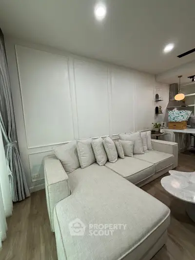 Modern living room with elegant sectional sofa and stylish decor