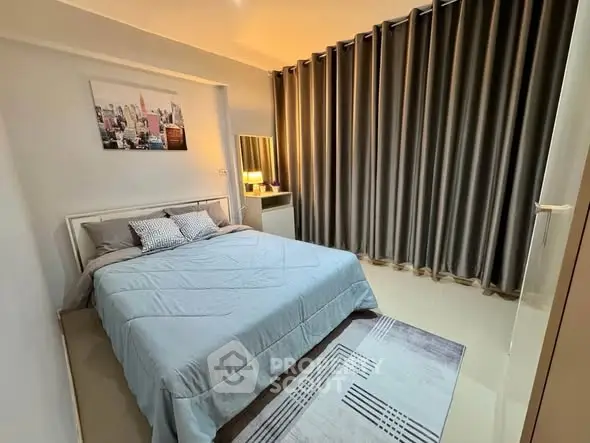 Cozy bedroom with modern decor and soft lighting, featuring a comfortable bed and stylish curtains.