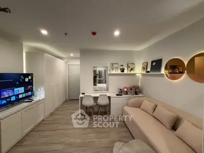 Modern living room with stylish decor and cozy seating area, perfect for relaxation and entertainment.