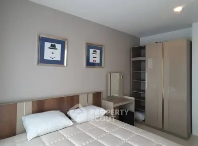 Modern bedroom with stylish decor and ample storage space