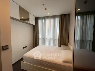 Modern bedroom with large window and minimalist design