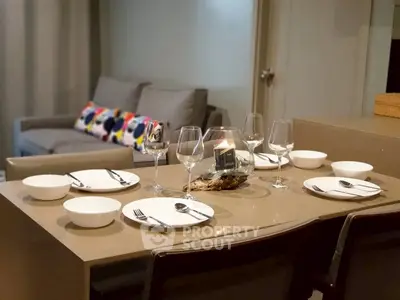 Modern dining area with elegant table setting in a cozy living room
