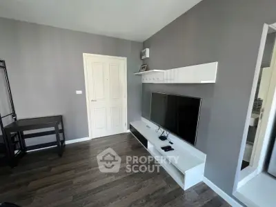 Modern living room with sleek TV setup and stylish wooden flooring