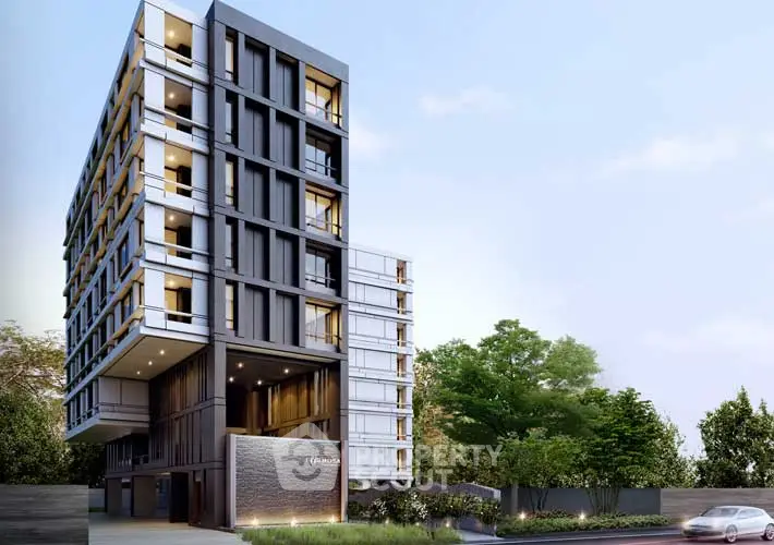 Modern apartment building with sleek design and lush greenery, ideal for urban living.