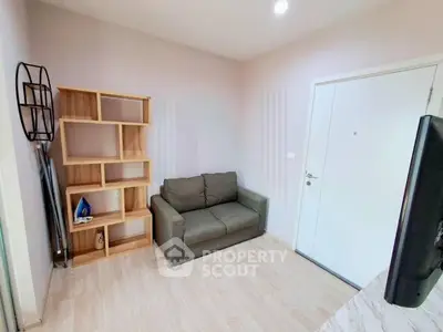 Cozy living room with modern sofa and stylish wooden shelving unit, perfect for relaxation and storage.