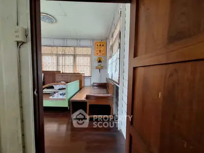 Charming vintage interior with wooden furniture and natural light, perfect for cozy living.